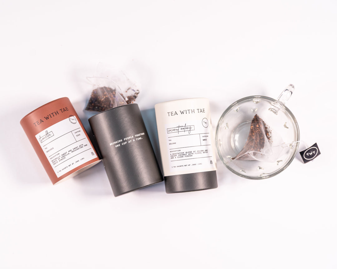 Two tea tubes, holding 5 tea sachets each, in the flavors of Honella and Coconut Oolong