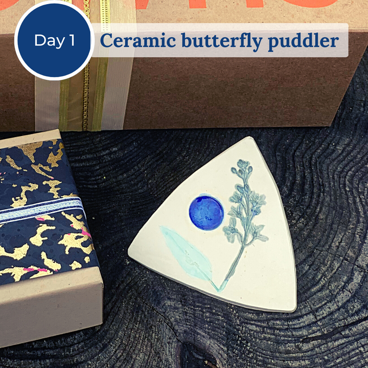 tan and blue ceramic butterfly puddler