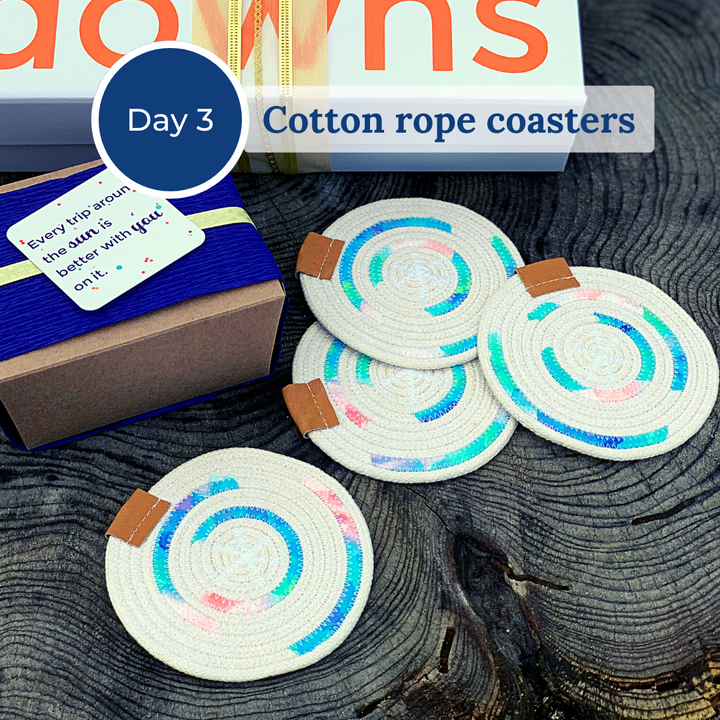 Four blue and tan cotton rope coasters