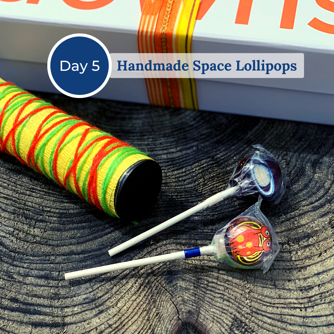 Two wrapped handmade space lollipops
