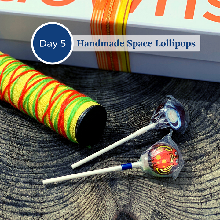 Two wrapped handmade space lollipops
