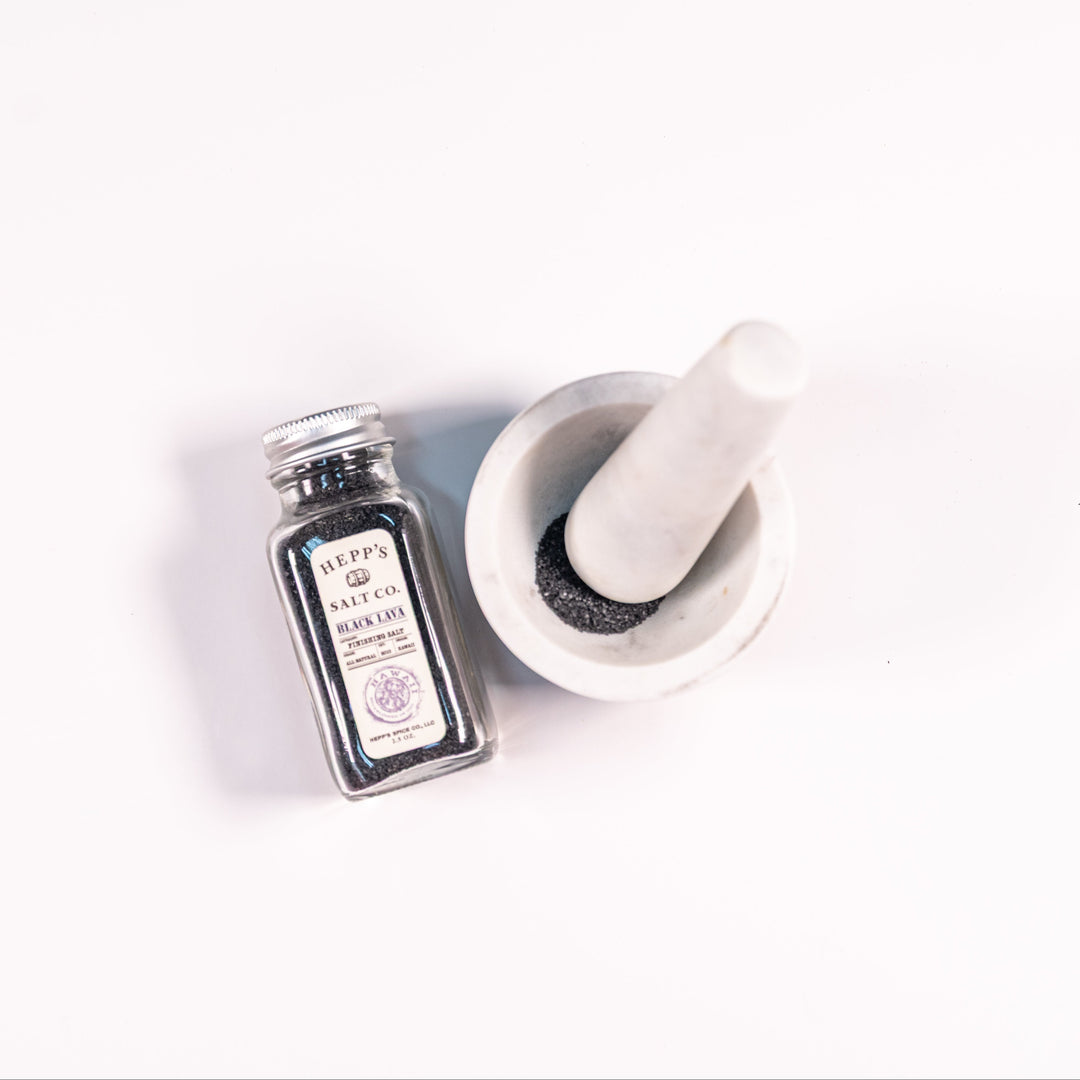 A 2.5 oz glass bottle of Hepp's black lava salt