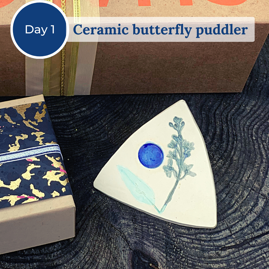 Tan and blue ceramic butterfly puddler