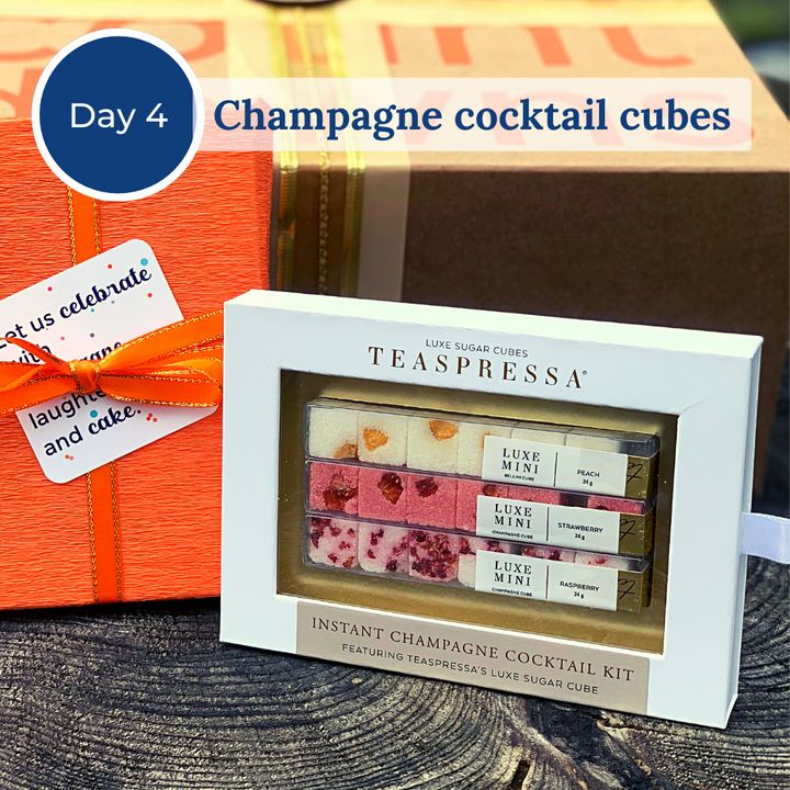 A gift box with three sets of champagne cocktail cubes