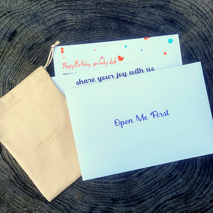 Three white 'Open me first' envelopes